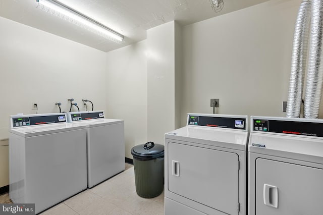 community laundry room with washer and dryer