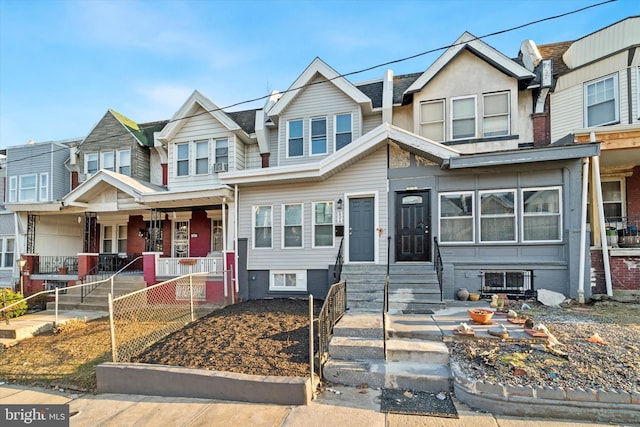 townhome / multi-family property featuring a porch