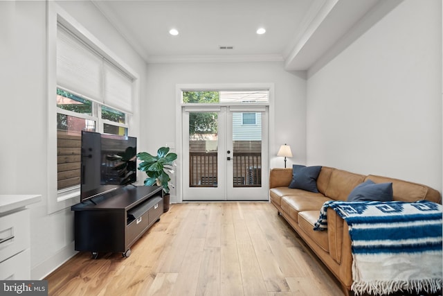 living area with visible vents, crown molding, french doors, light wood-style floors, and recessed lighting