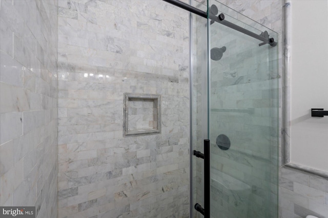 full bathroom featuring a shower stall