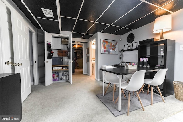 dining area featuring carpet flooring and visible vents