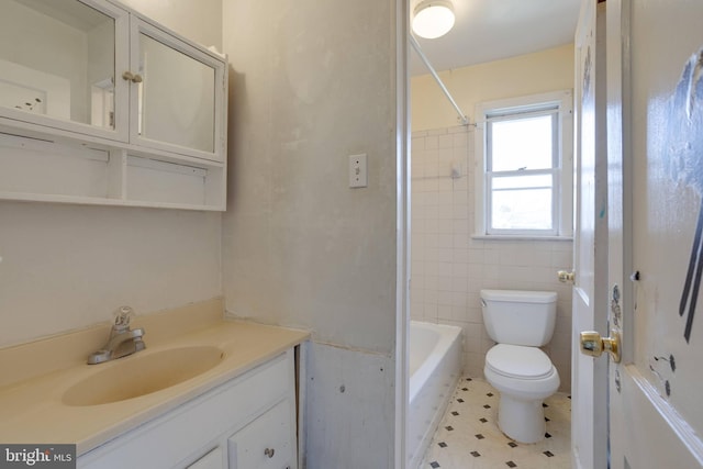 full bathroom with  shower combination, vanity, toilet, and tile walls