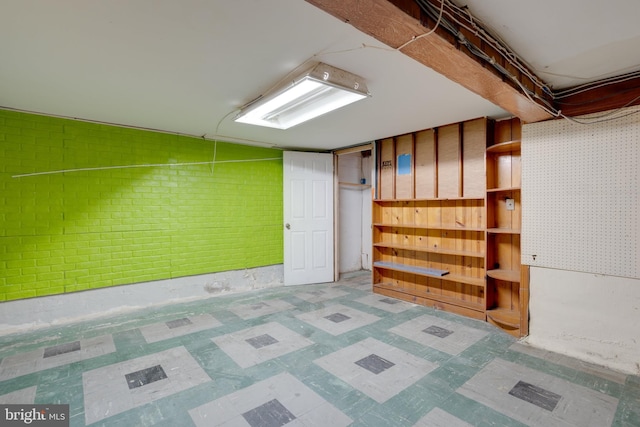 unfinished basement featuring tile patterned floors