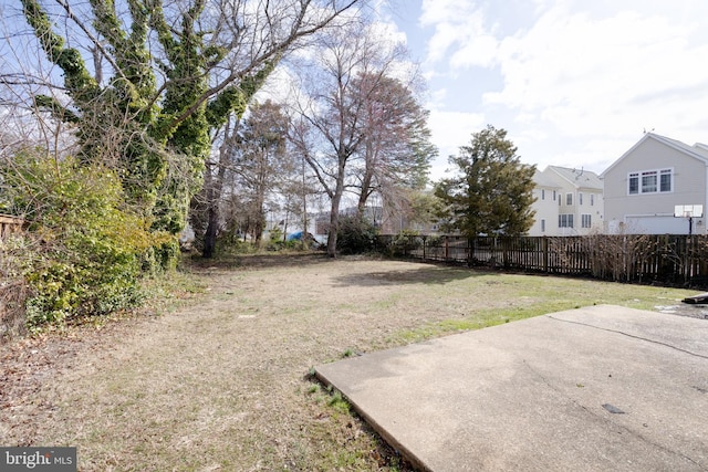 view of yard with fence and a patio