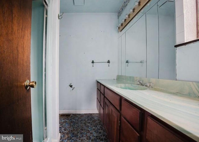 bathroom featuring vanity and baseboards