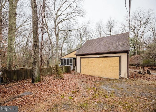 garage with fence