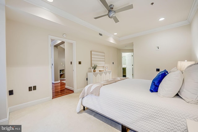 carpeted bedroom featuring visible vents, baseboards, a ceiling fan, crown molding, and recessed lighting