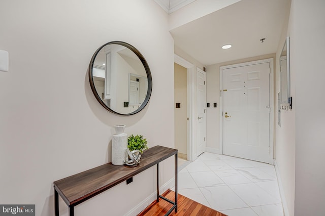 entryway featuring baseboards