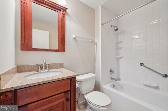 bathroom featuring toilet, vanity, and bathtub / shower combination