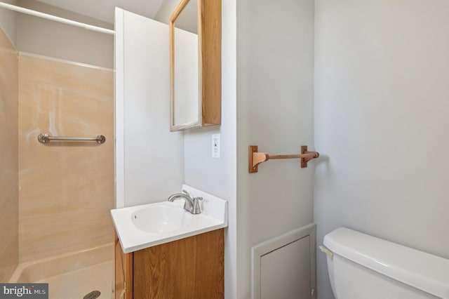 full bath featuring a shower stall, toilet, and vanity