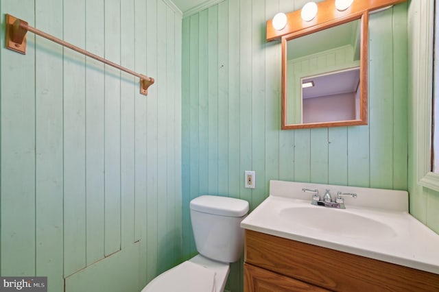 bathroom featuring toilet and vanity