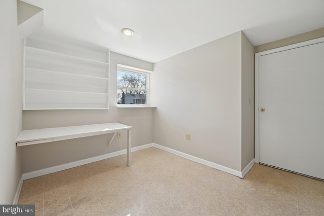 unfurnished bedroom featuring tile patterned floors and baseboards