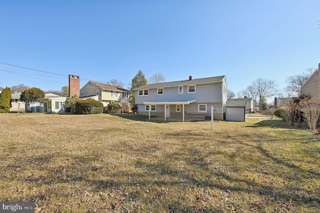 rear view of property with a lawn