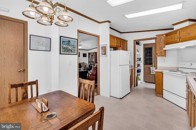 dining room featuring ceiling fan with notable chandelier, light floors, and ornamental molding