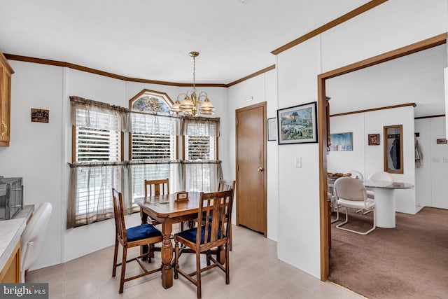 dining space with ornamental molding, light colored carpet, and an inviting chandelier