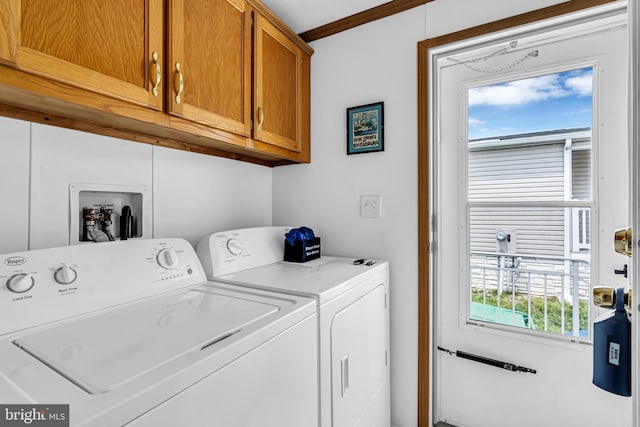 laundry room featuring cabinet space and separate washer and dryer