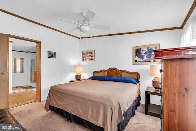 bedroom featuring ornamental molding, carpet, and ceiling fan