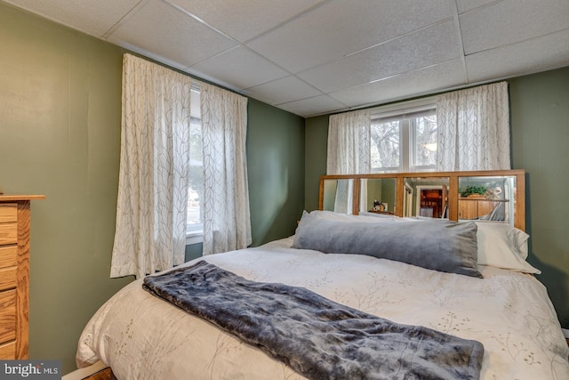 bedroom with a paneled ceiling