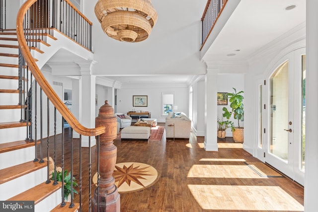 803 Coachway, Annapolis, MD 21401 - foyer featuring hardwood / wood-style floors, decorative columns, stairs, a towering ceiling, and crown molding
