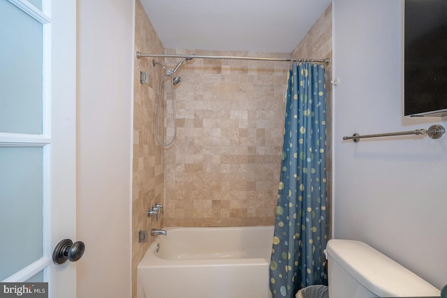 full bathroom featuring shower / tub combo and toilet