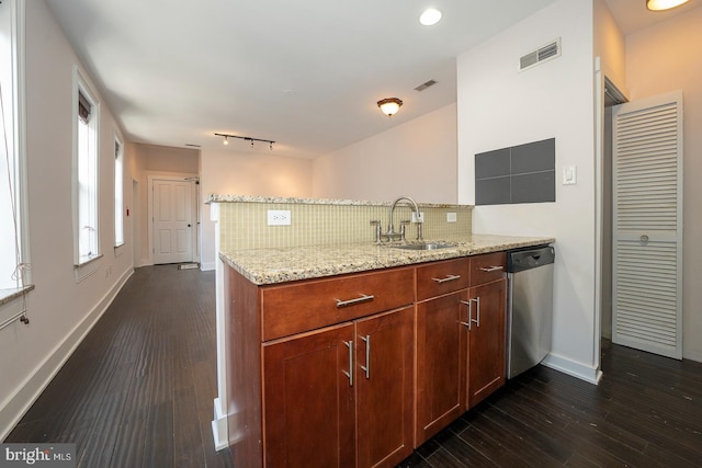 kitchen with tasteful backsplash, visible vents, stainless steel dishwasher, a sink, and a peninsula