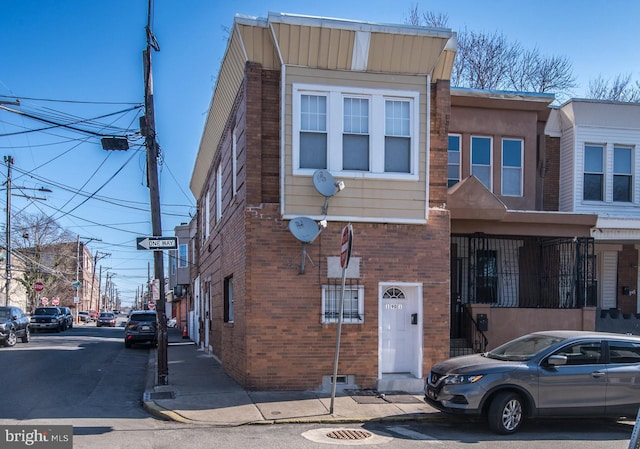 view of property with brick siding