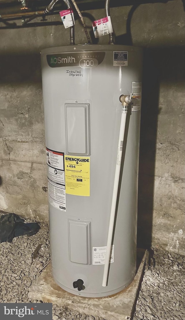 utility room featuring electric water heater