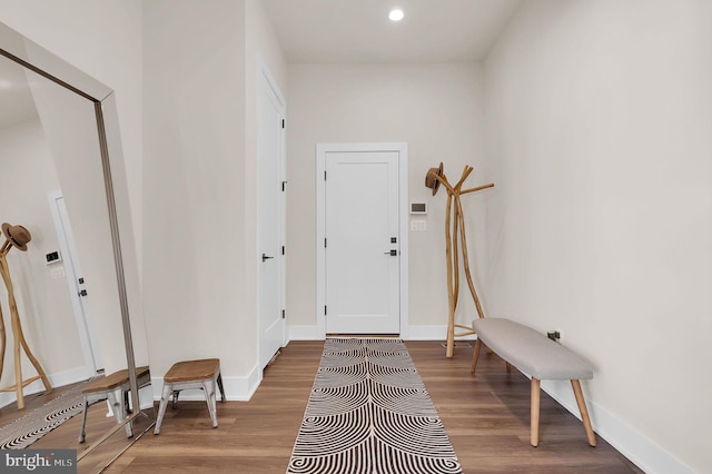 foyer featuring recessed lighting, baseboards, and wood finished floors