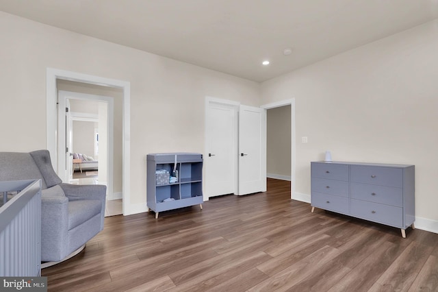 sitting room with recessed lighting, wood finished floors, and baseboards