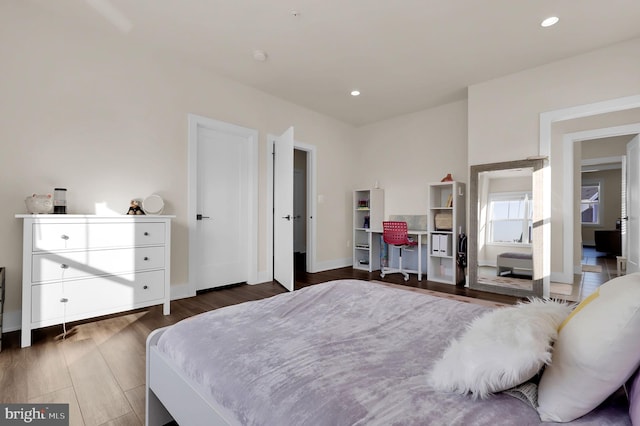 bedroom featuring recessed lighting, baseboards, and wood finished floors