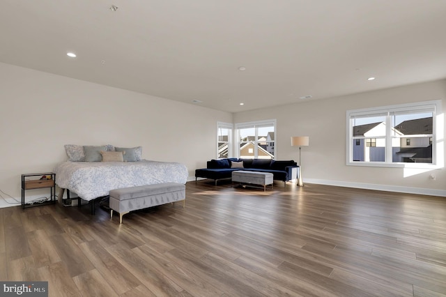 bedroom featuring recessed lighting, baseboards, and wood finished floors