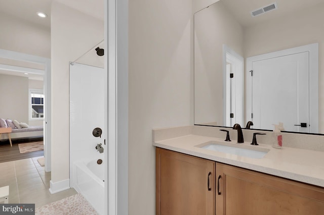 full bath with tile patterned flooring, visible vents, shower / washtub combination, and vanity