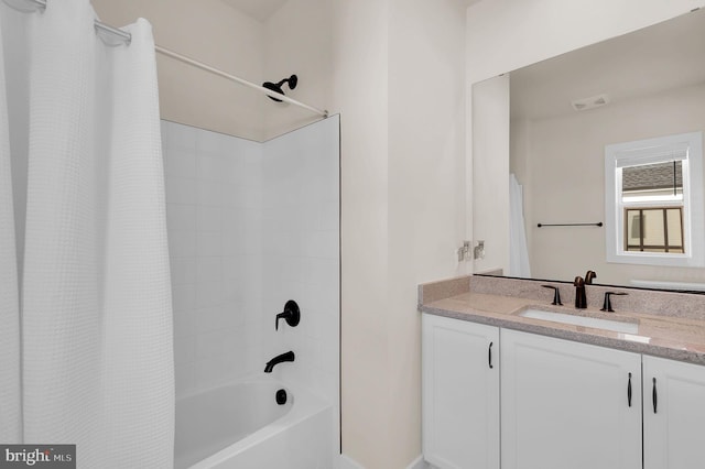 bathroom featuring vanity, shower / bathtub combination with curtain, and visible vents