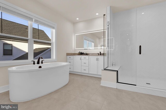 full bath featuring vanity, a soaking tub, recessed lighting, tile patterned flooring, and a shower stall