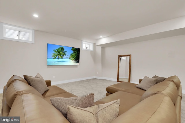 living room with recessed lighting, baseboards, and carpet flooring