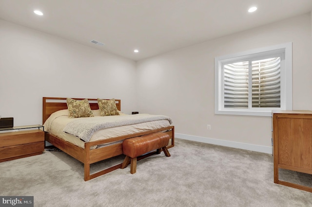 bedroom featuring recessed lighting, visible vents, baseboards, and light colored carpet