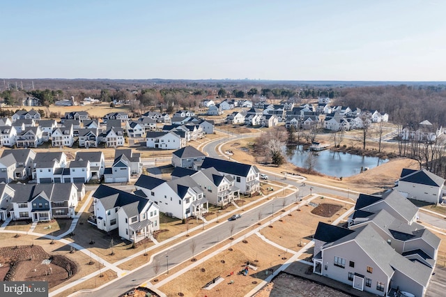 aerial view with a residential view and a water view