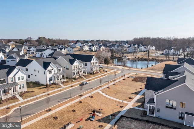 birds eye view of property featuring a residential view and a water view