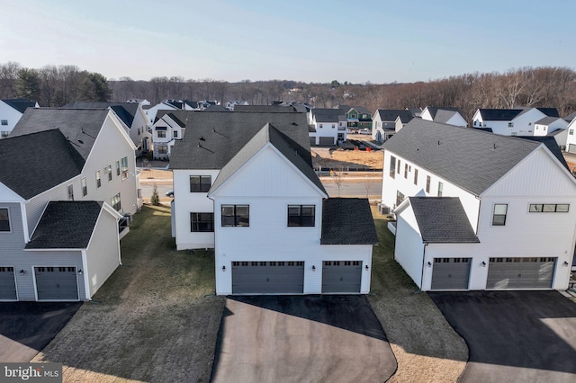 birds eye view of property with a residential view