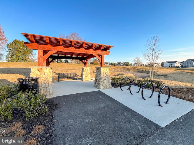 view of community with a patio area and a pergola