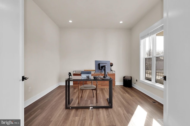 office featuring visible vents, recessed lighting, wood finished floors, and baseboards