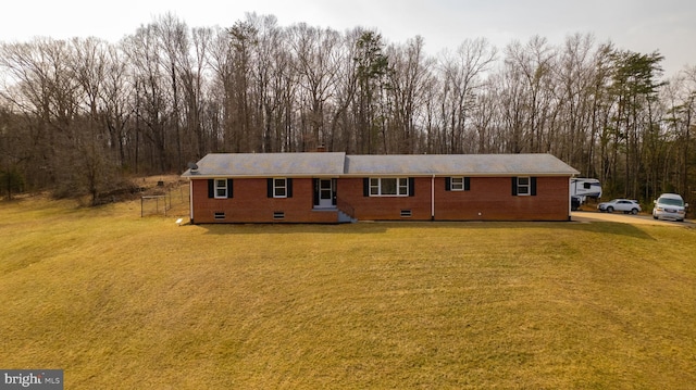 ranch-style house featuring a front yard, crawl space, and brick siding