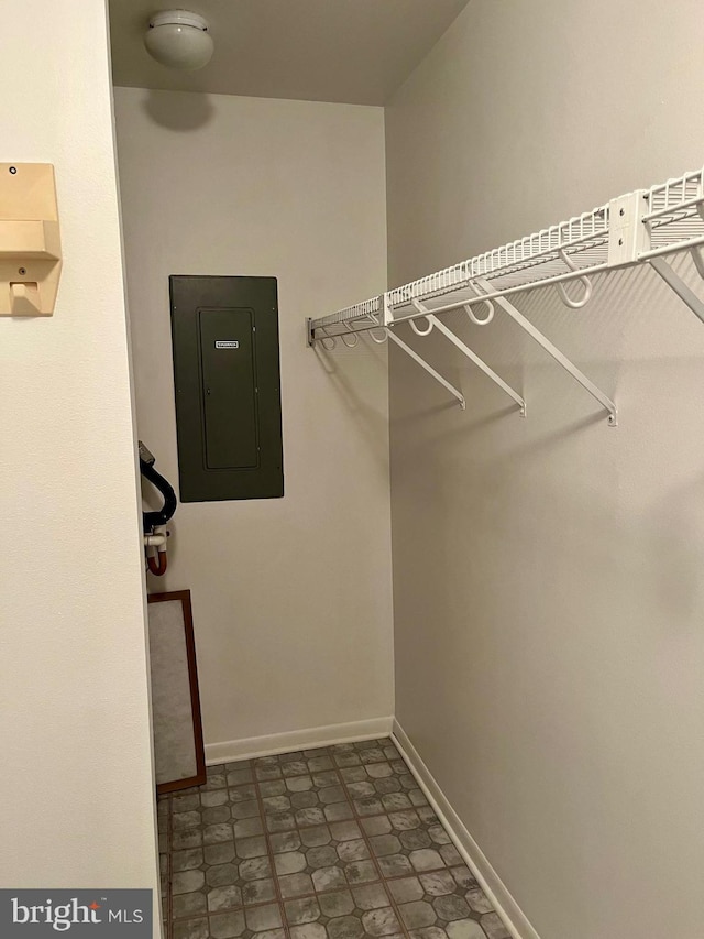 walk in closet featuring electric panel