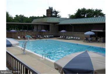 community pool with a patio area