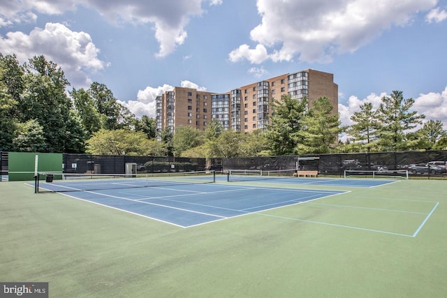 view of tennis court with fence