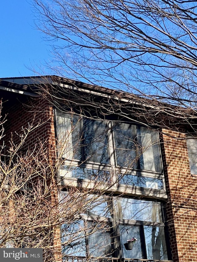 view of home's exterior featuring brick siding