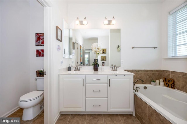 bathroom featuring a garden tub, double vanity, toilet, a sink, and tile patterned flooring