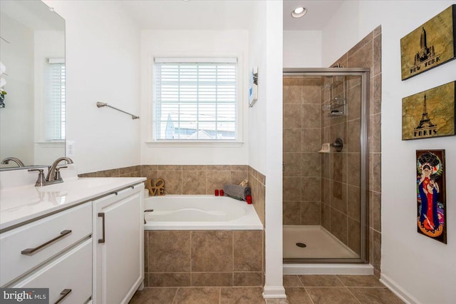 full bath with a garden tub, a shower stall, vanity, and tile patterned floors