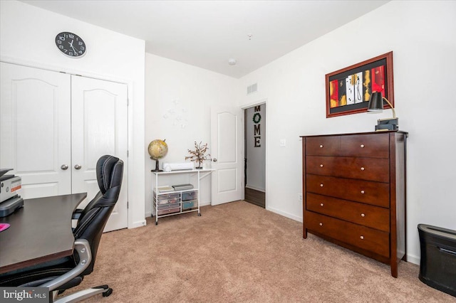 carpeted office with baseboards