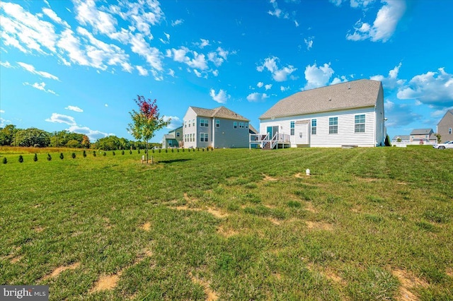 back of house with a yard